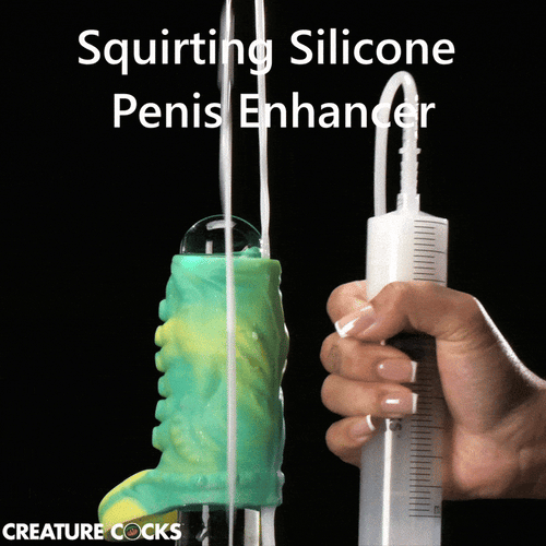 Creature Cocks green and yellow tentacle penis enhancer with a hand-held syringe squirting fluid.