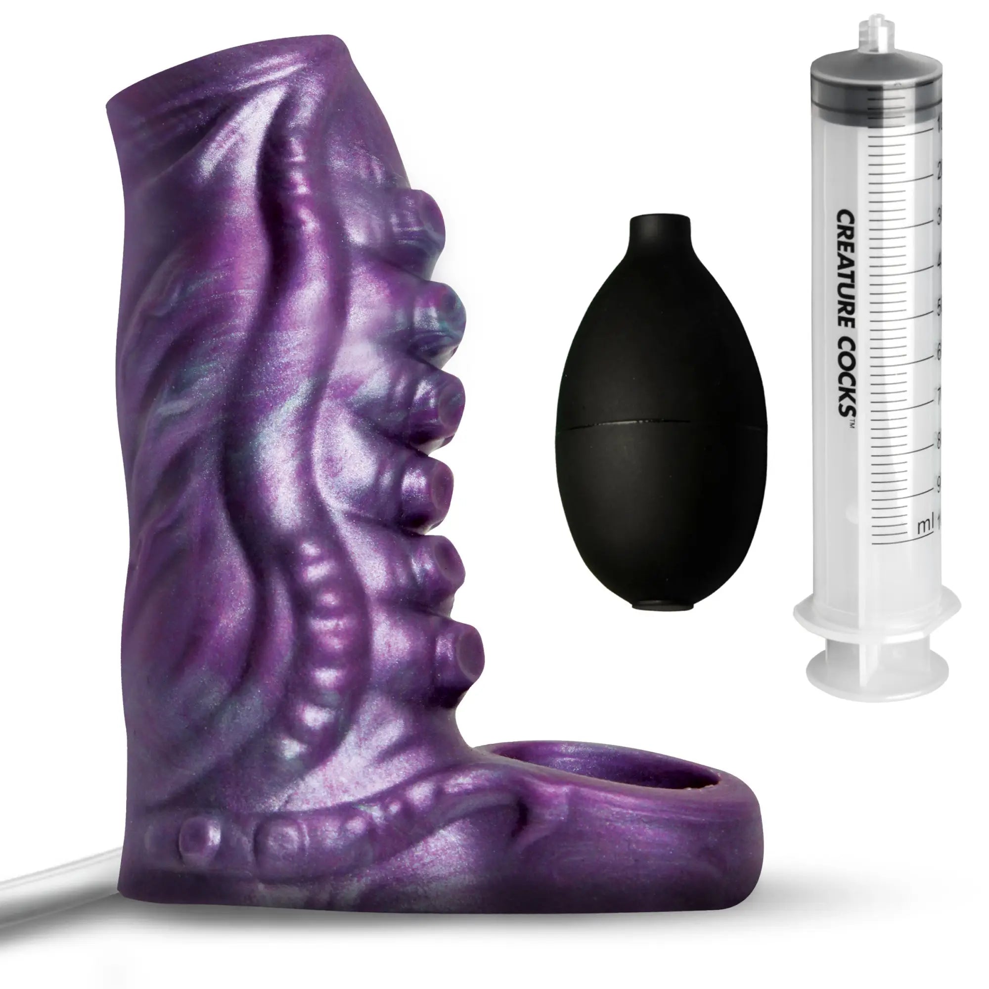 Creature Cocks purple tentacle silicone penis enhancer, shown with a black air pump and a branded fluid syringe.