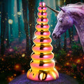 Creature Cocks Twilight Rainbow glass dildo with a ridged, iridescent gold-to-pink finish beside a magical unicorn.