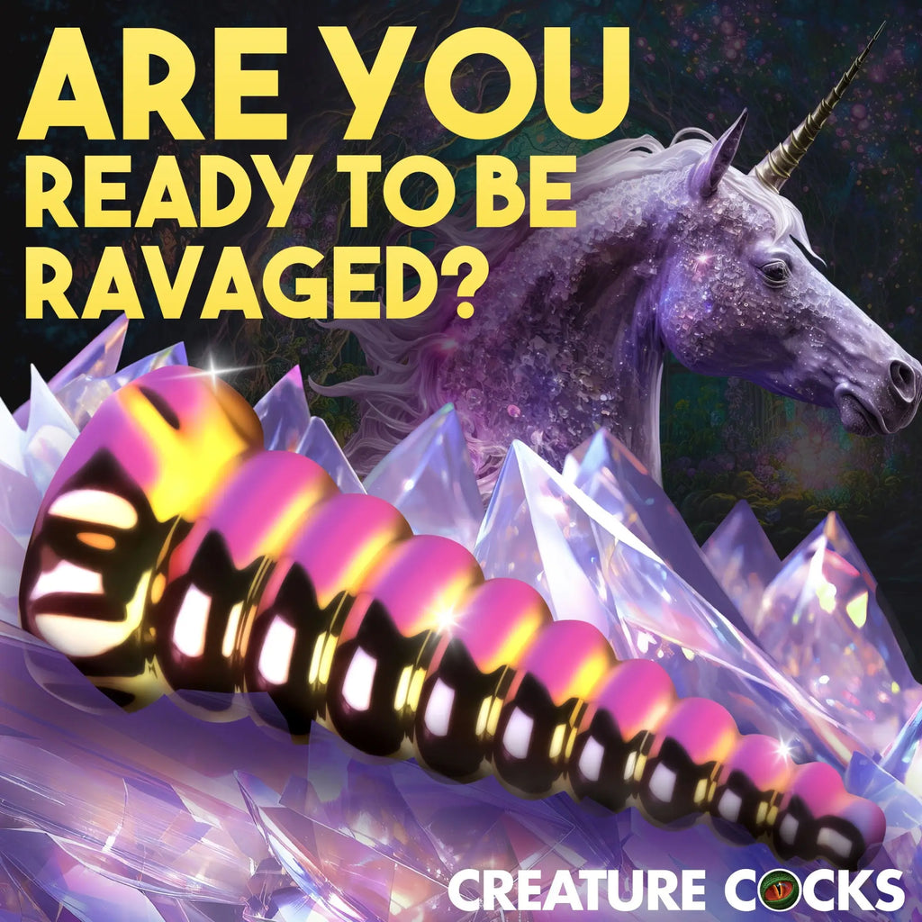 Creature Cocks Twilight Rainbow glass dildo with a ribbed, iridescent finish against a magical unicorn background.
