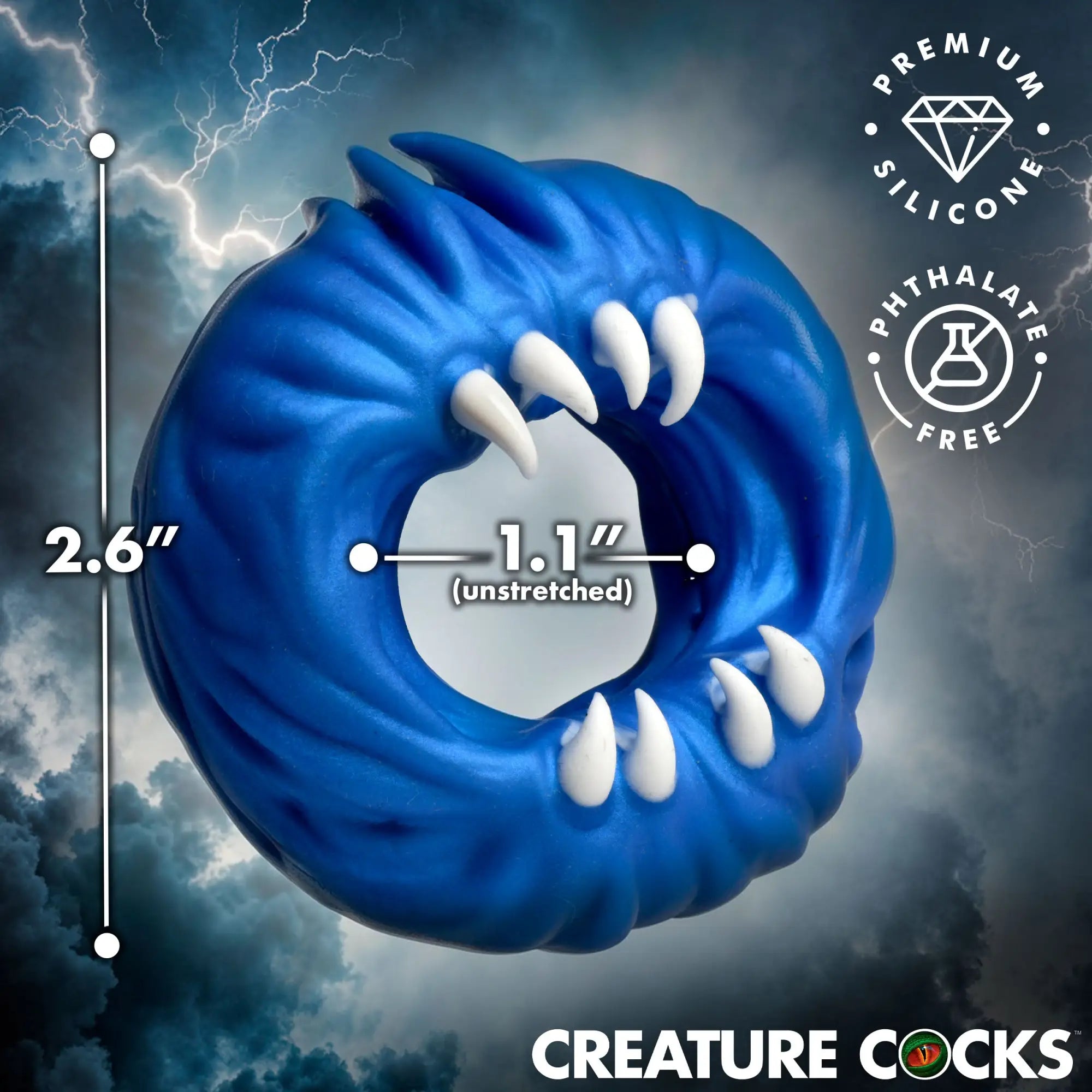 Creature Cocks Venom Loop blue silicone cock ring featuring white monster fangs, with 2.6" outer and 1.1" inner diameter.