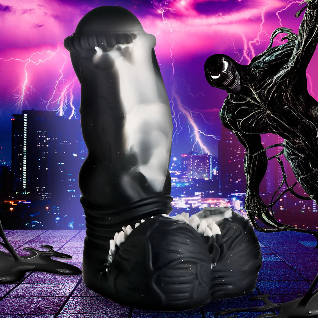 Creature Cocks Venom silicone dildo: black, textured fantasy-style dildo with white accents against a stormy city backdrop.