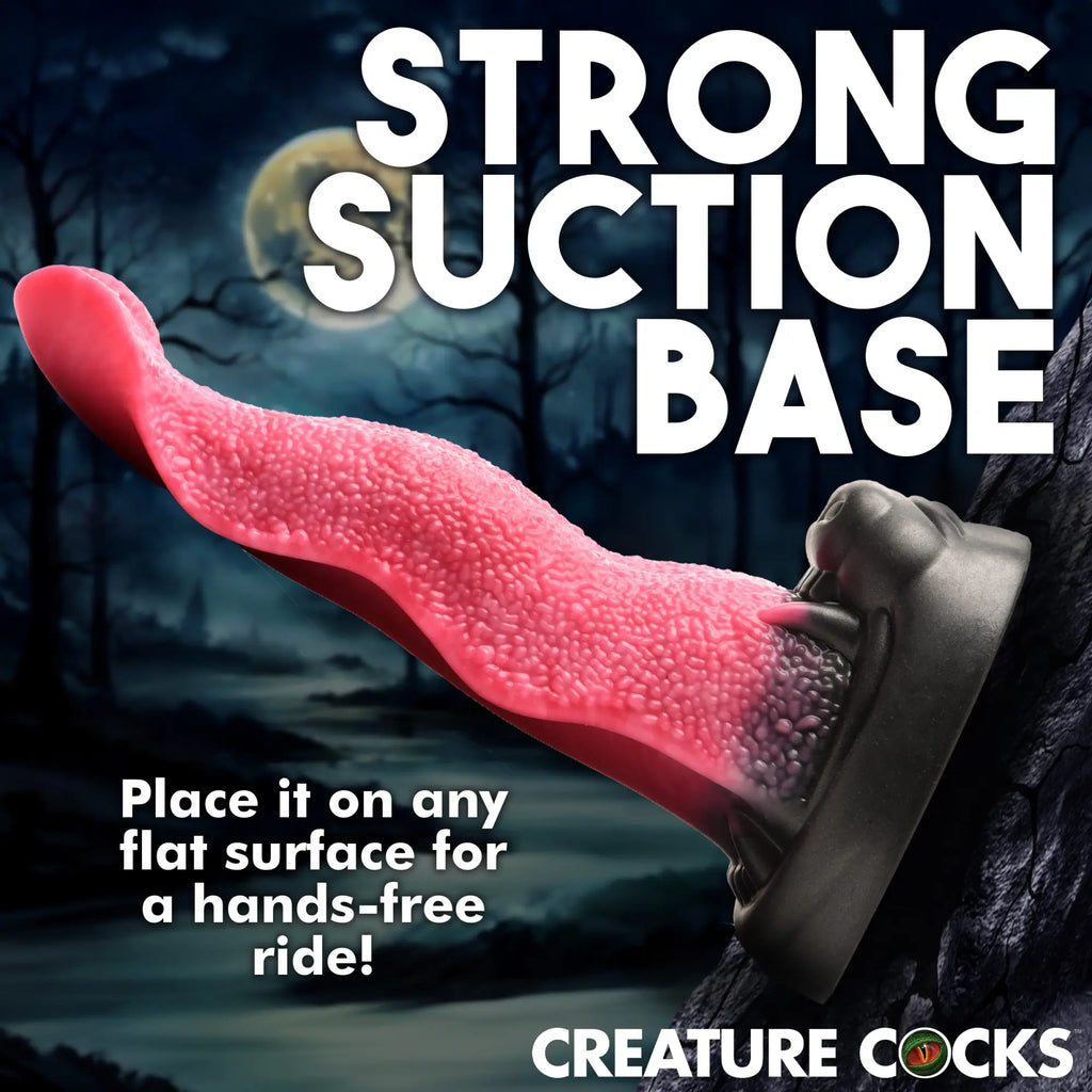 Creature Cocks Wolf’s Lick dildo featuring a textured pink tongue attached to a black suction cup base.