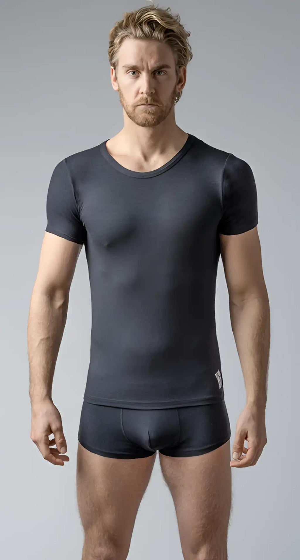 Black short-sleeved crew neck t-shirt made of stretchy fabric worn with matching shorts for casual wear