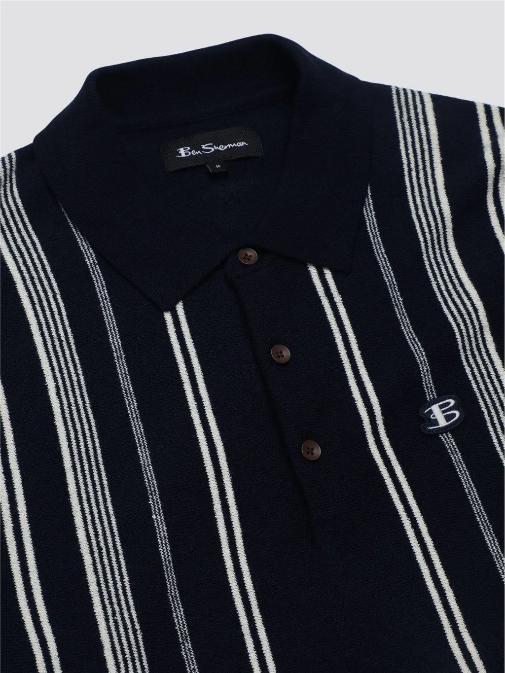 Navy blue and white striped crinkle cotton knit polo shirt with a small embroidered logo on the chest