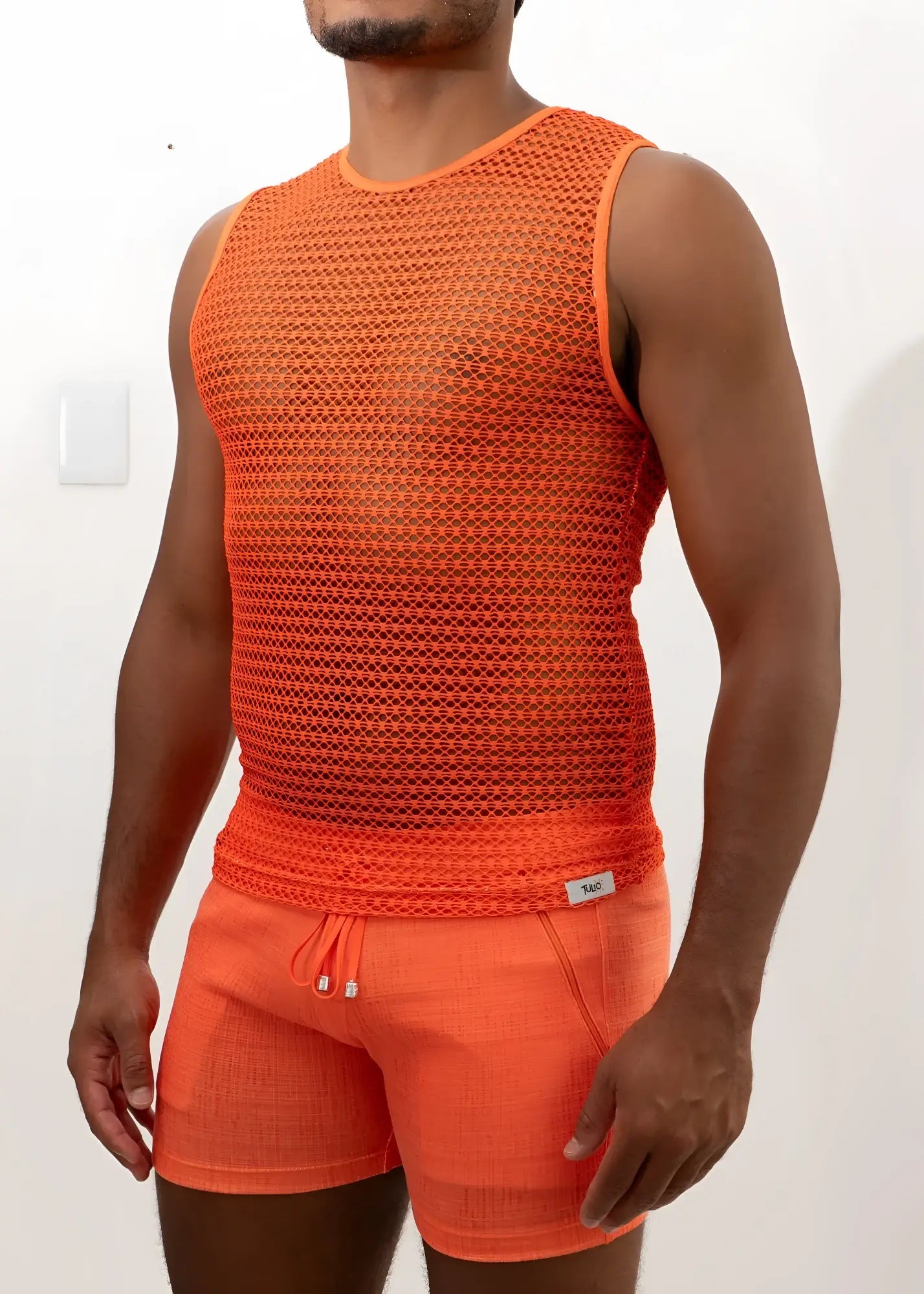 Orange crochet muscle tank top sleeveless with round neckline and elastic waistband in breathable mesh fabric