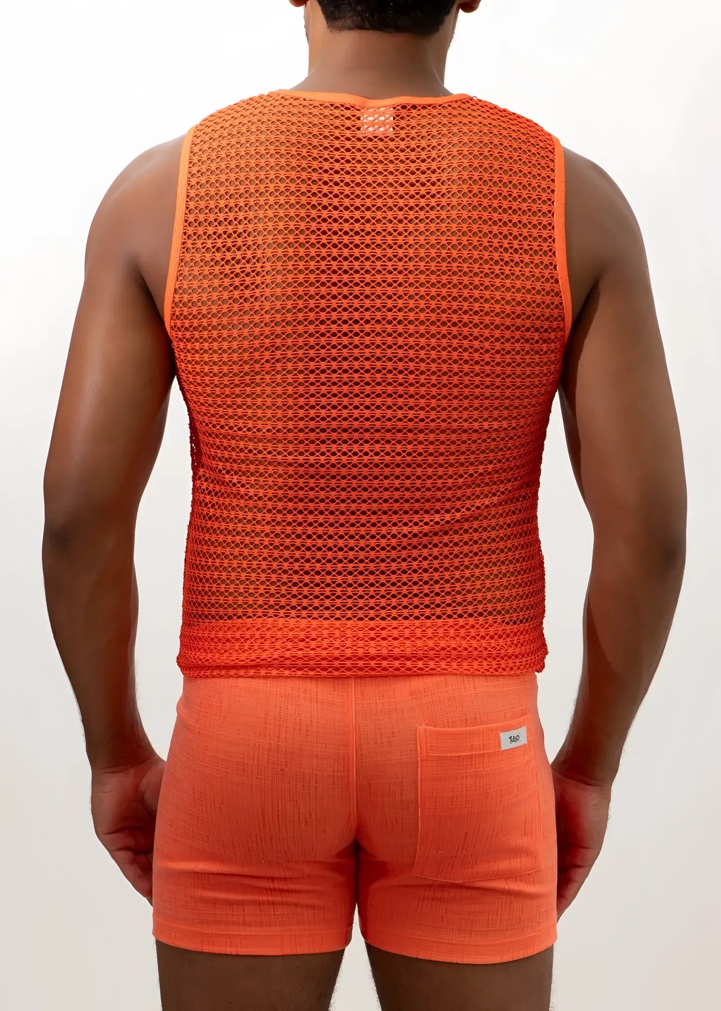 Orange crochet muscle tank top with breathable textured mesh fabric and small brand tag at the neckline