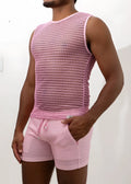 Pink crochet muscle tank top with subtle geometric mesh pattern paired with matching pink drawstring shorts