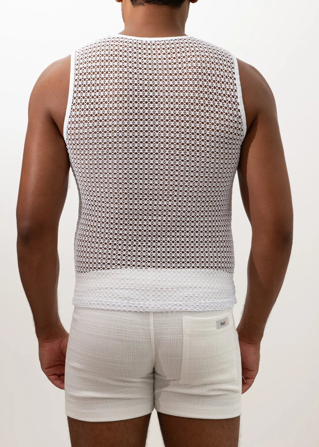 White crochet muscle tank top featuring a mesh design with a solid white band at the bottom for casual wear
