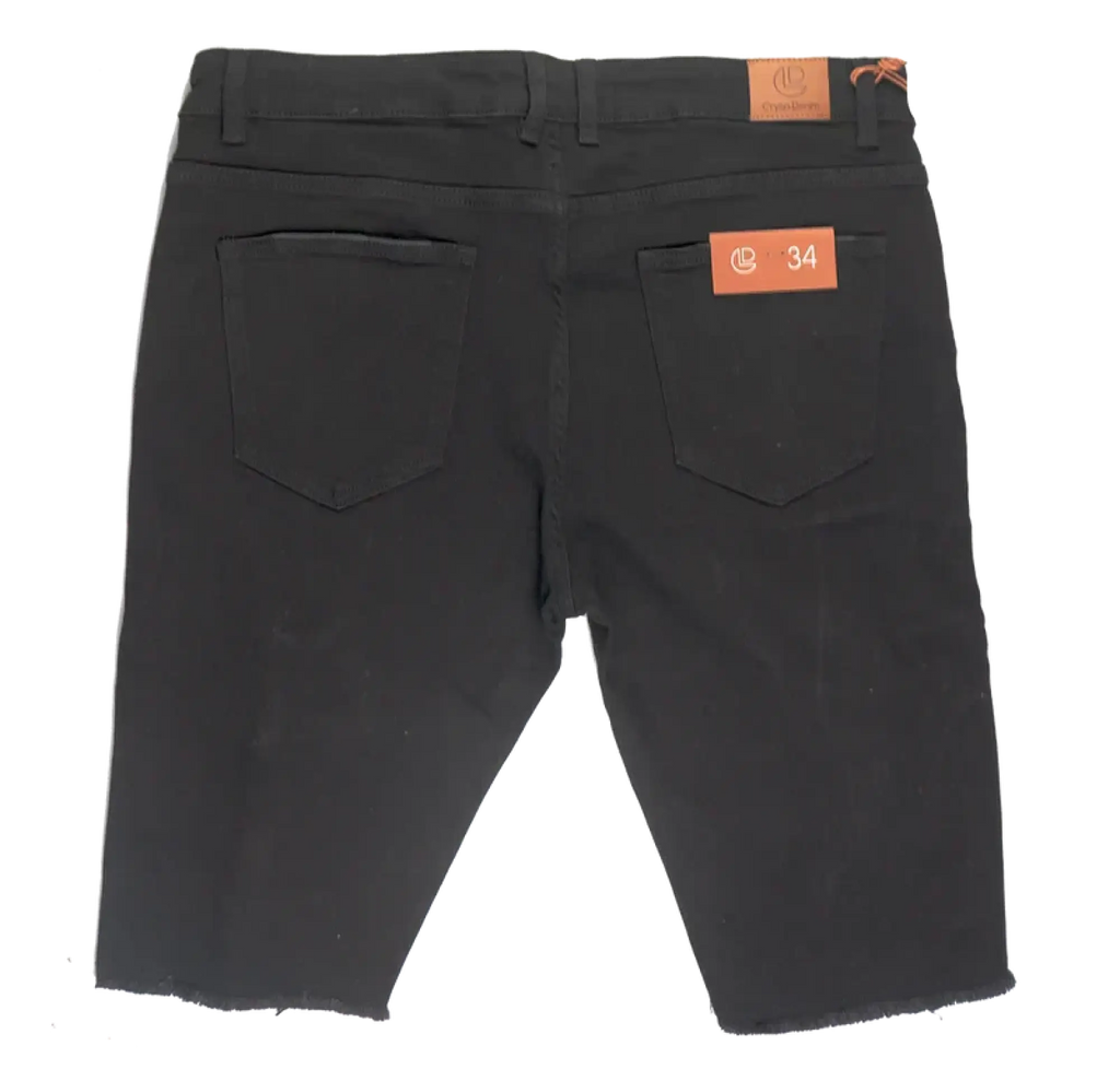 Back view of crysp denim cut off short black slim fit denim shorts with two back pockets and orange brand tags