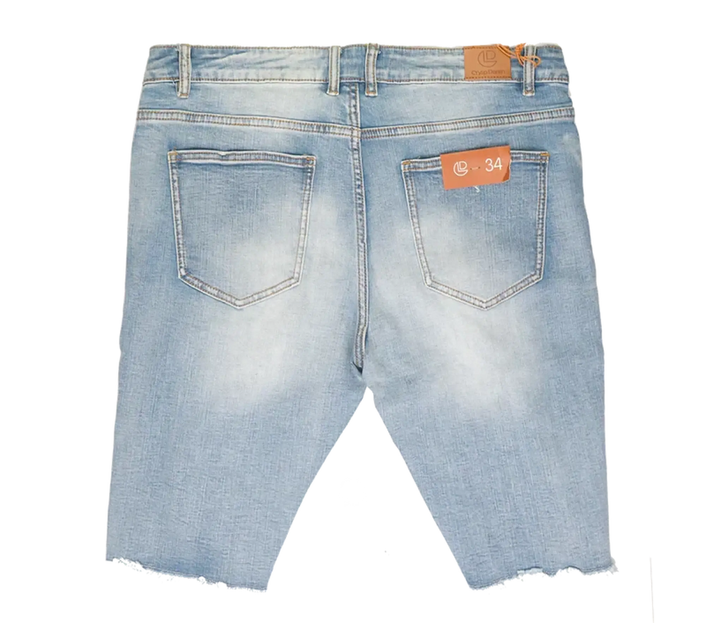 Light-wash crysp denim cut off shorts with frayed hem and orange brand tags front view