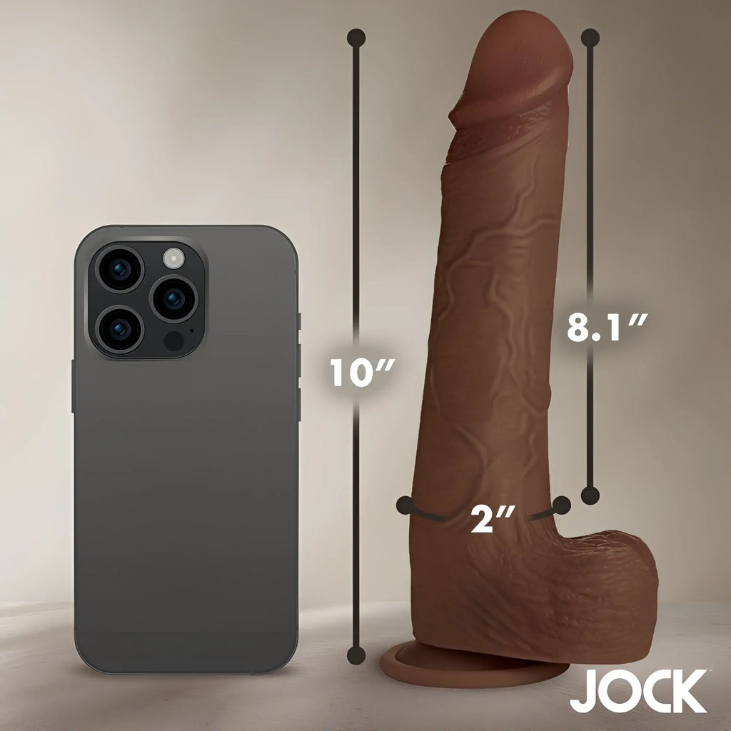 Curve Toys 10-inch brown realistic silicone dildo with balls, shown next to a smartphone for size reference.