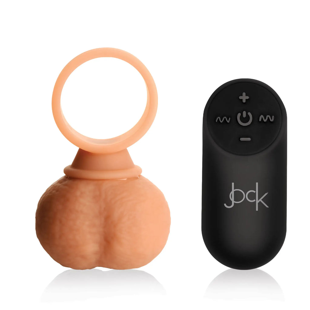 Curve Toys 28X Vibrating Realistic Balls: tan, realistic textured scrotum ring with a black wireless remote control.