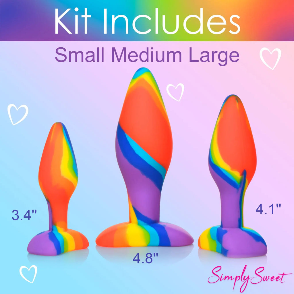Curve Toys 3pc rainbow silicone butt plug set featuring small, medium, and large sizes with a swirling multicolored pattern.