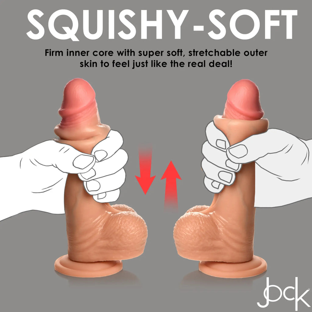 Curve Toys 8-inch flesh-toned silicone dildo with balls, being squeezed by an illustrated hand to show flexibility.