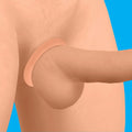 Curve Toys Discreet Silicone Cock Ring: A smooth, beige, flexible ring shown worn at the base of the penis.
