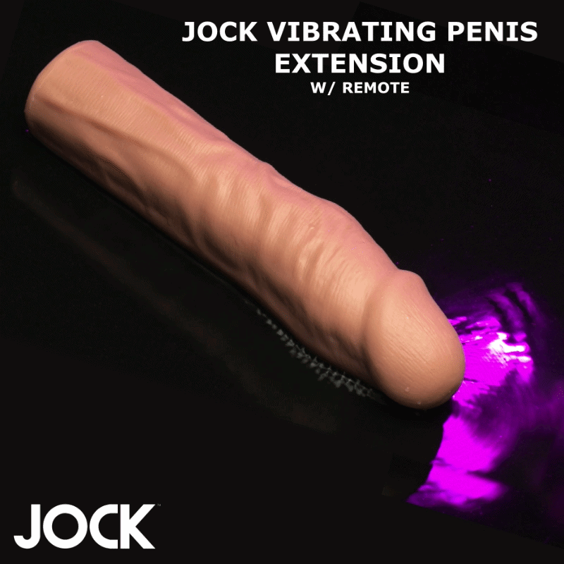 Curve Toys 1.5" realistic vibrating penis extension in tan, set against a black background with purple lighting.