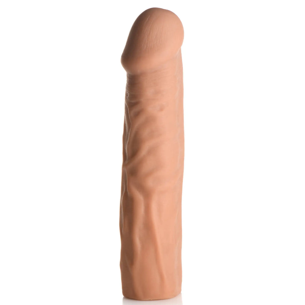 Curve Toys 1.5-inch beige, realistic textured penis extension sleeve on a plain white background.