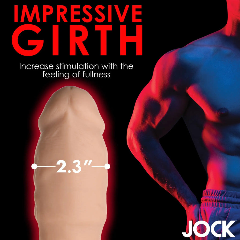 Curve Toys 2-inch beige penis extension with a 2.3-inch diameter shown next to a muscular man in a red-lit background.
