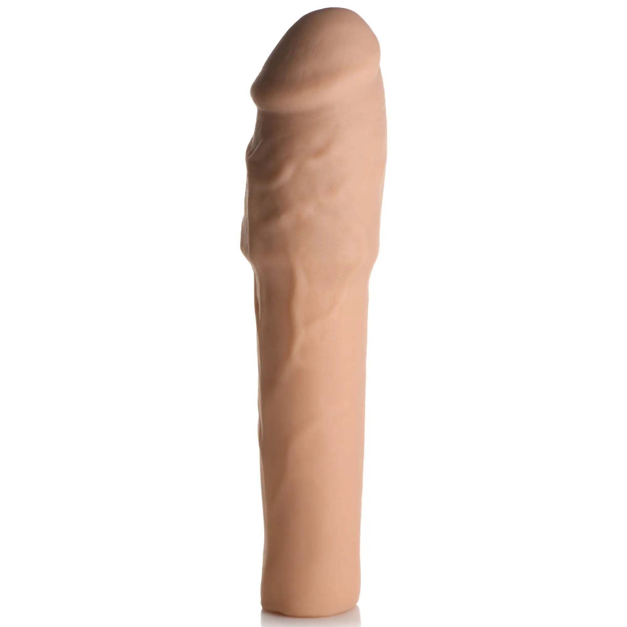 Curve Toys Extra Thick 2-inch penis extension in tan, featuring a realistic textured, veined, and contoured design.