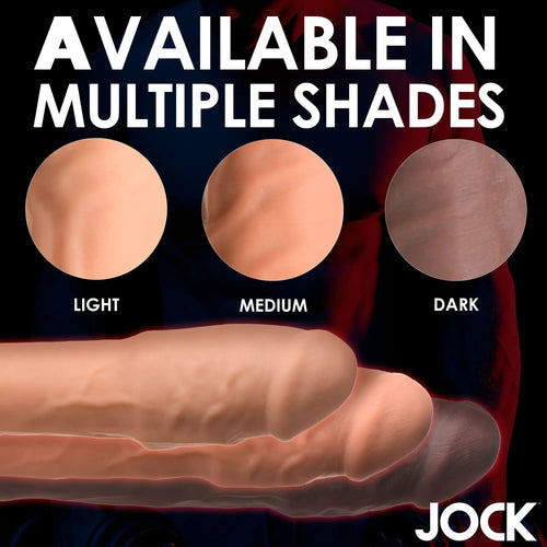 Curve Toys 2-inch penis extension shown in light, medium, and dark skin tones against a black background.