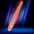 Curve Toys JOCK 13-inch tapered, flesh-toned double dildo with realistic texture, set against a neon-lit background.