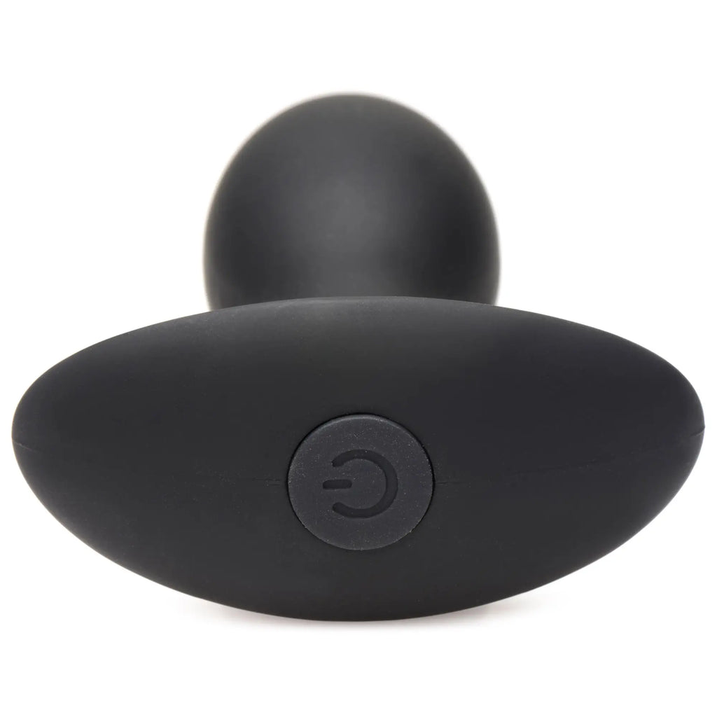 Curve Toys Rumbler: Matte black silicone vibrating butt plug with a rounded base featuring a power button.