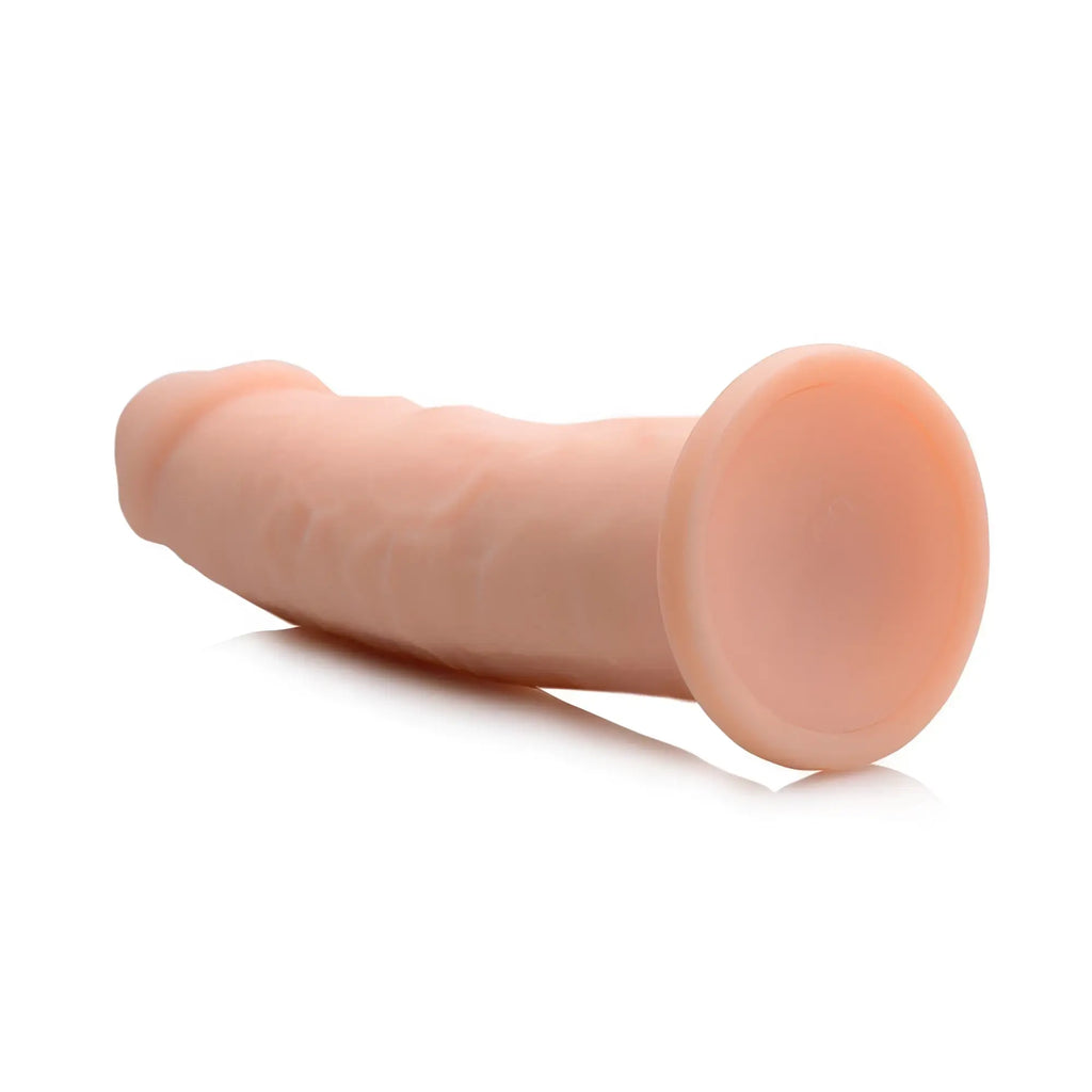 Curve Toys Silexpan hypoallergenic silicone dildo in peach with a realistic textured shaft and a flat suction-cup base.