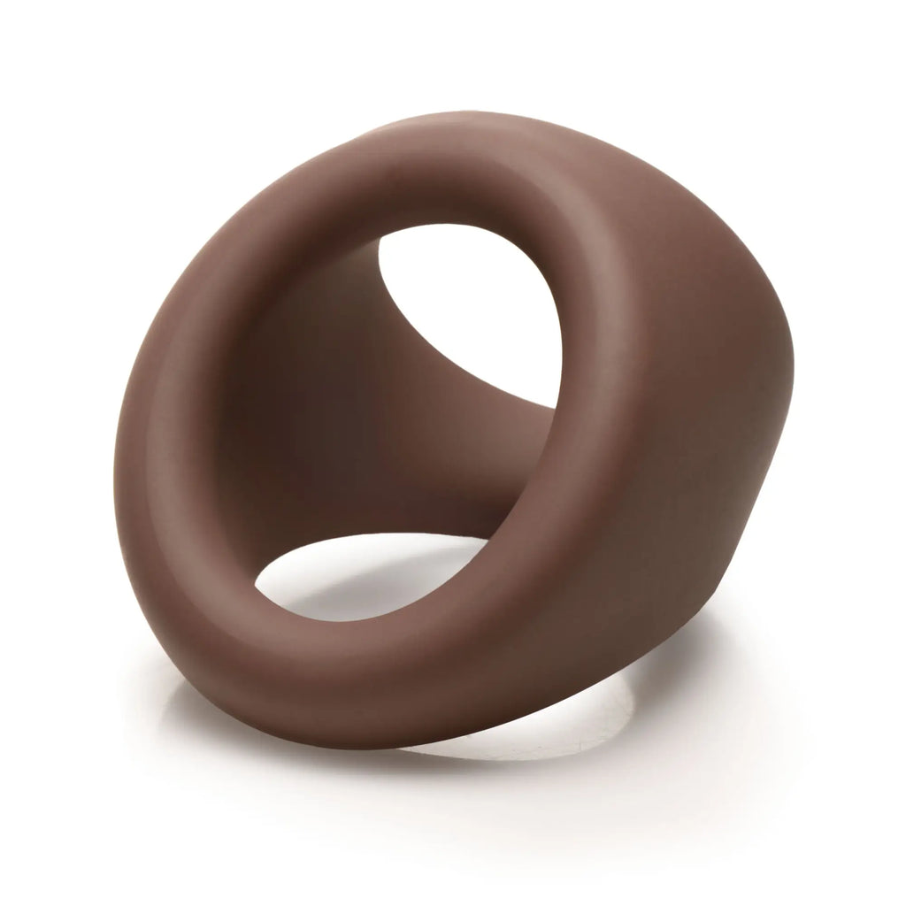 Curve Toys brown silicone cock and ball ring with an angled, ergonomic design on a white background.