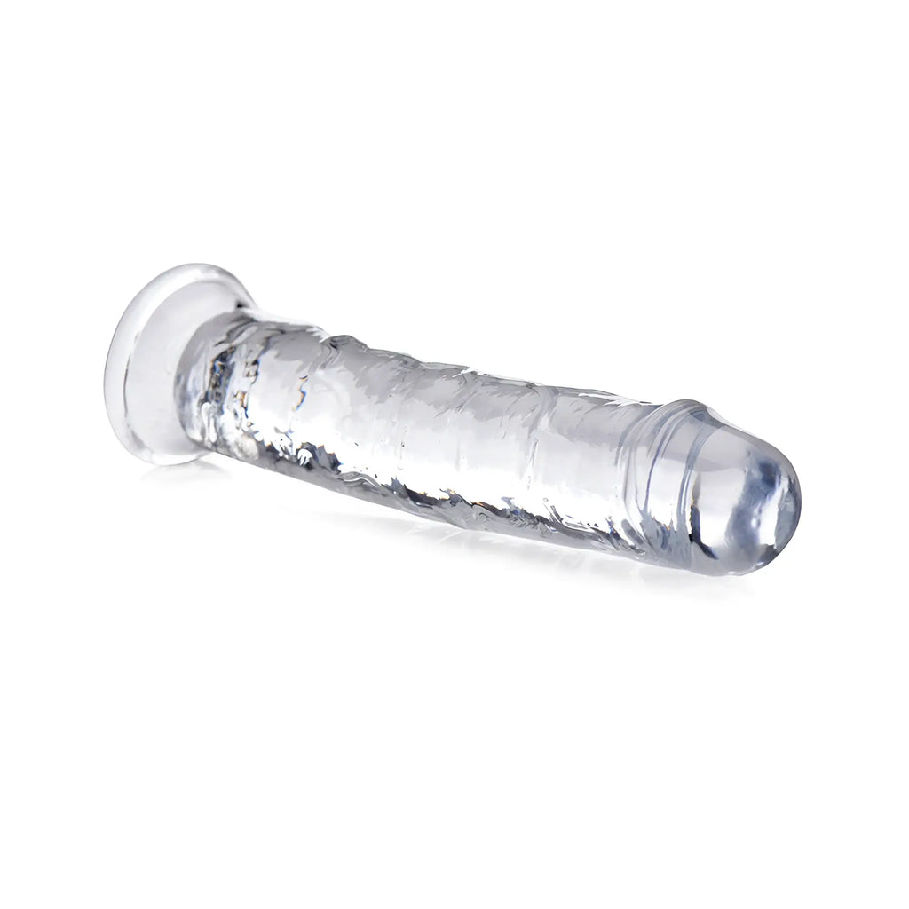 Curve Toys Slim C-Thru clear dildo with a textured shaft and flared base, isolated on a white background.