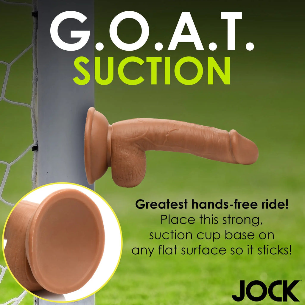 Curve Toys Soccer Sam 7-inch dildo with a tan, realistic texture and a strong suction cup base attached to a goalpost.