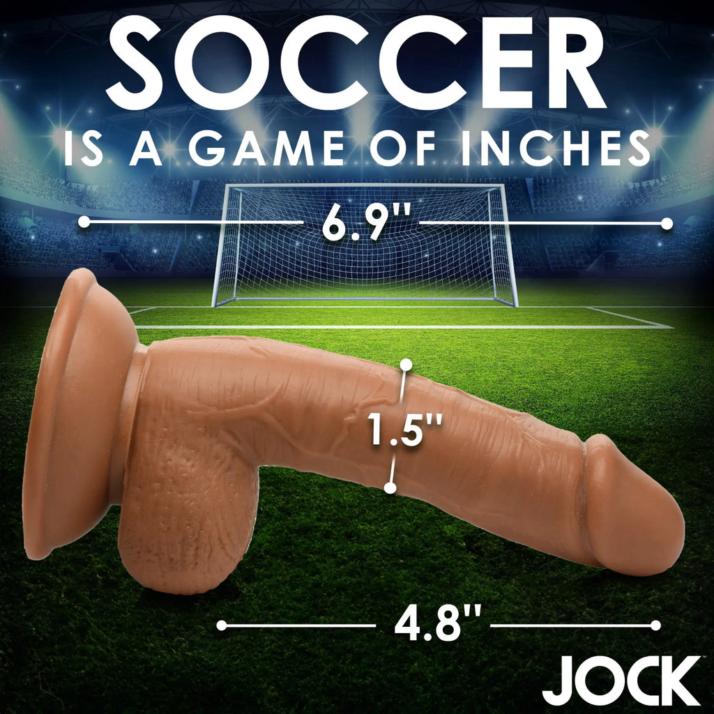 Curve Toys Soccer Sam: A realistic, tan, 7-inch textured dildo with a suction cup base against a soccer stadium backdrop.