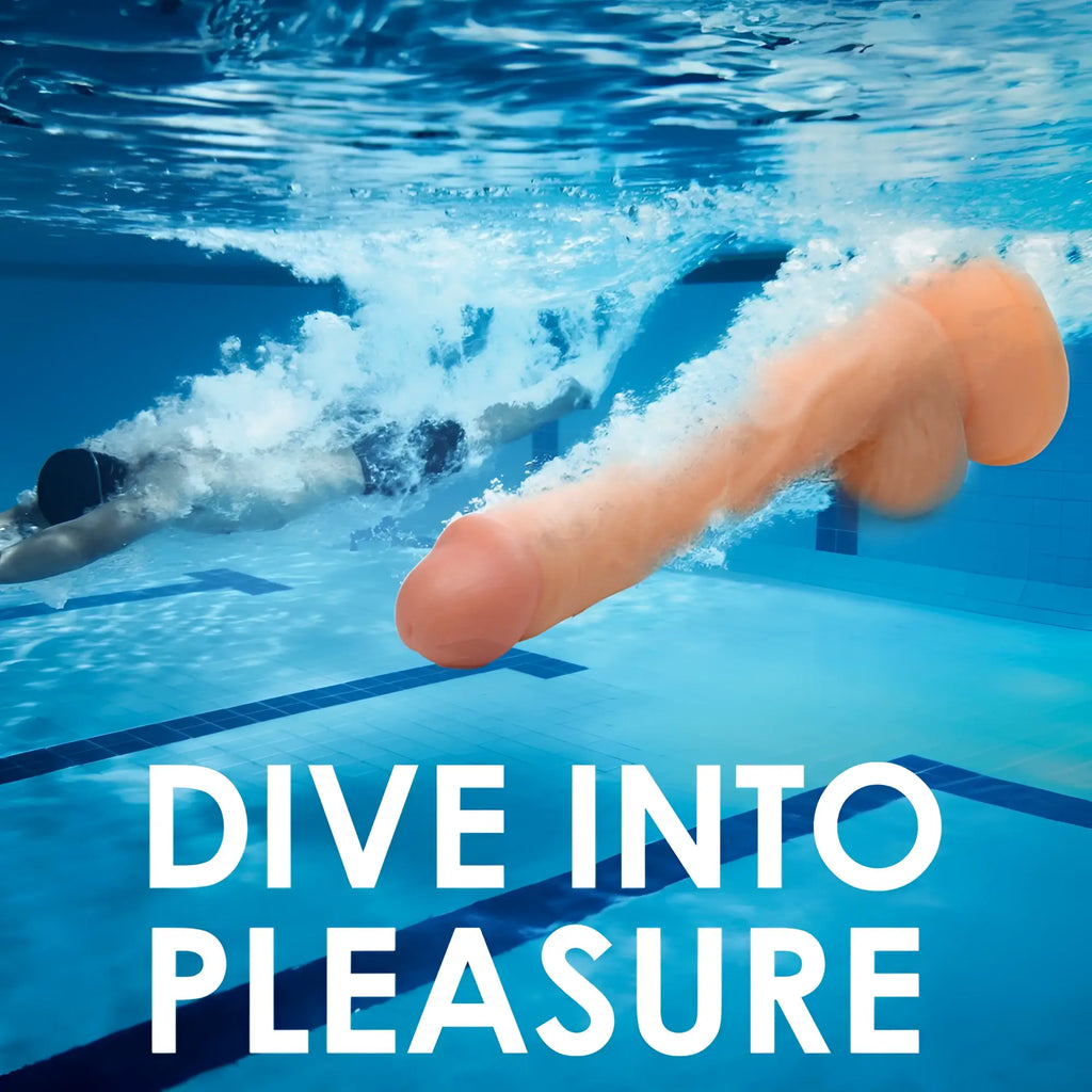 Curve Toys Swimming Simon 7-inch dildo, peach-colored, realistic style, underwater in a pool behind a swimming man.