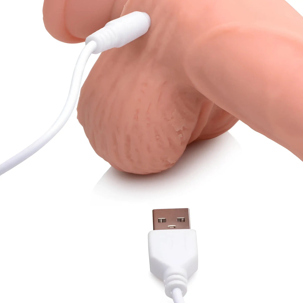 Curve Toys 8-inch dildo in flesh-tone, showing a realistic textured base with a white USB charging cable attached.