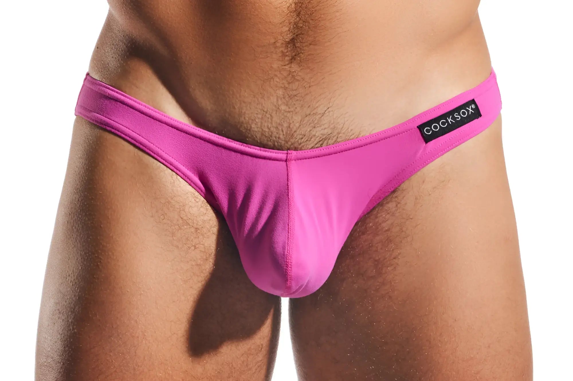 Bright pink cocksox cx01 brief thong made of smooth stretchy fabric with sleek design and brand label on waistband