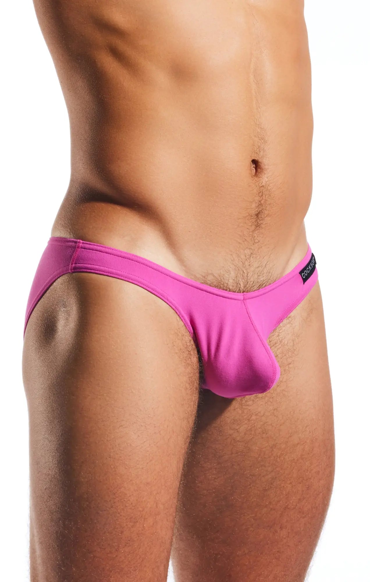 Bright pink cx01 brief swim trunks with a distinctive cut and smooth fabric for a form-fitting fit