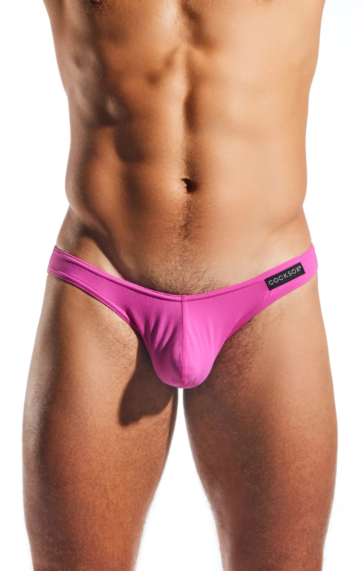 Bright pink form-fitting thong cx01 brief with black cookfox brand label on waistband showing back side