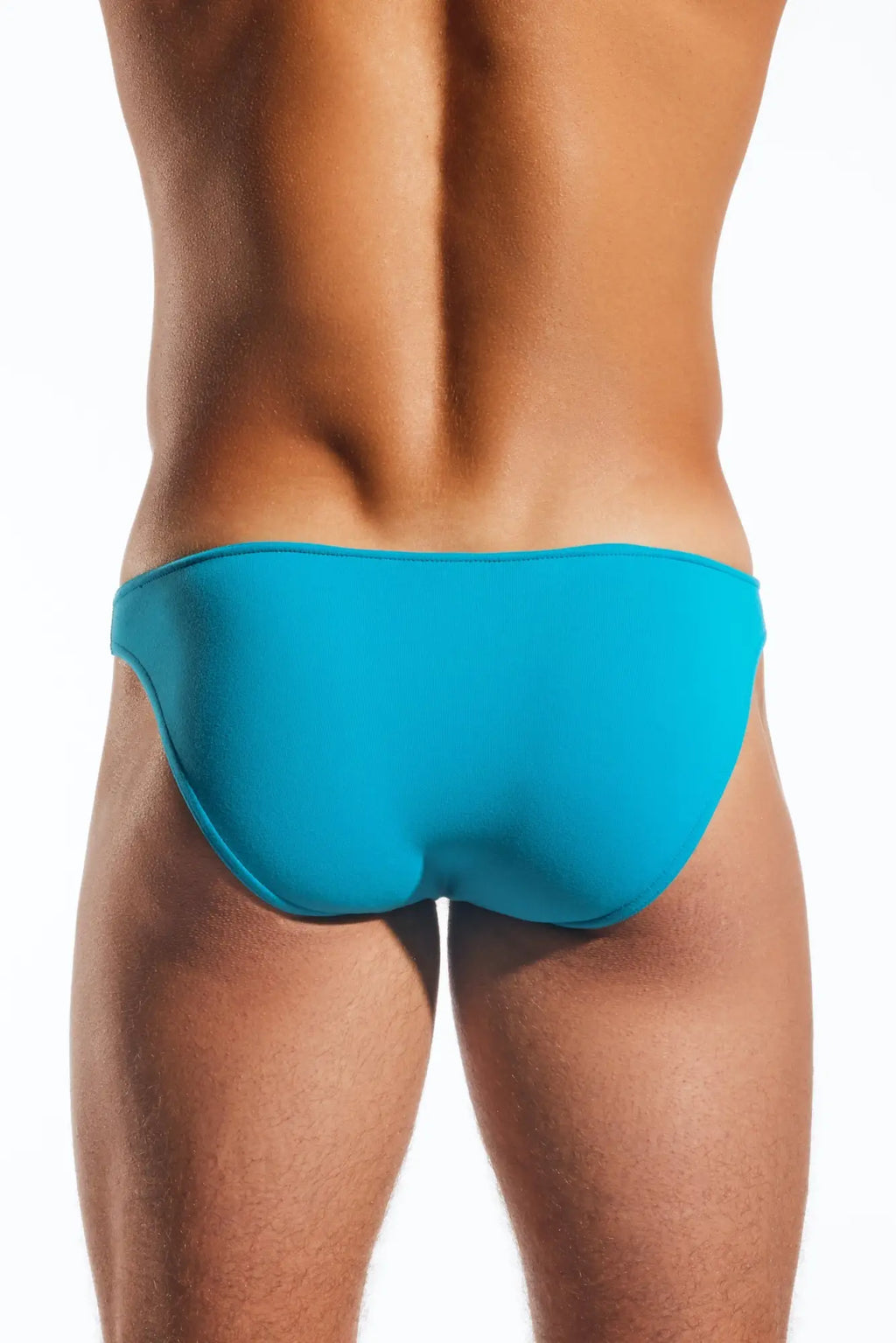 Bright turquoise cx01 brief swim trunks with smooth form fitting design ideal for swimming and beachwear