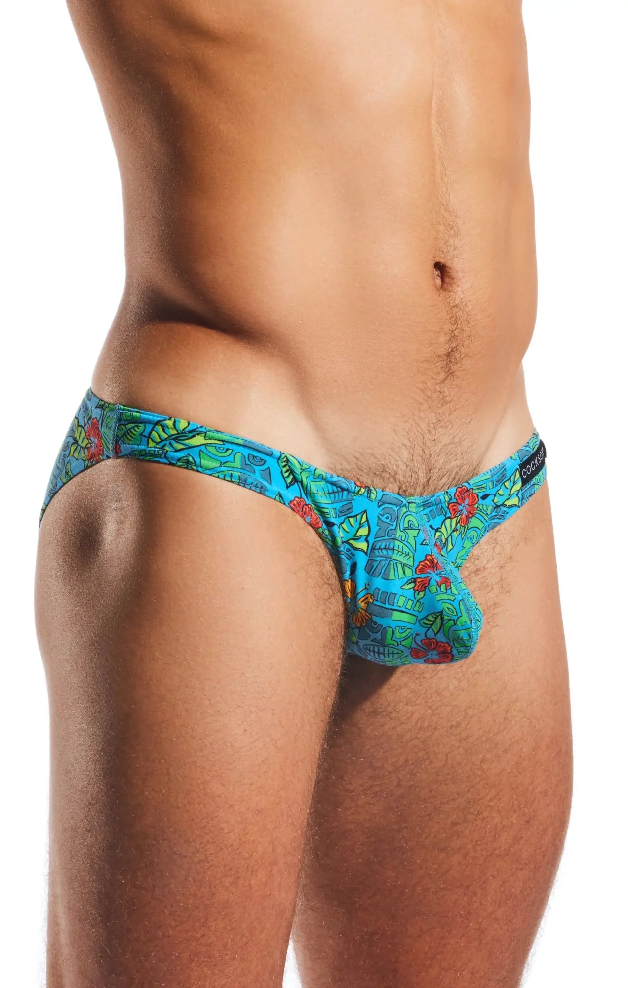 Cx01 brief vibrant turquoise tropical print swim trunks with red and green floral patterns for beachwear