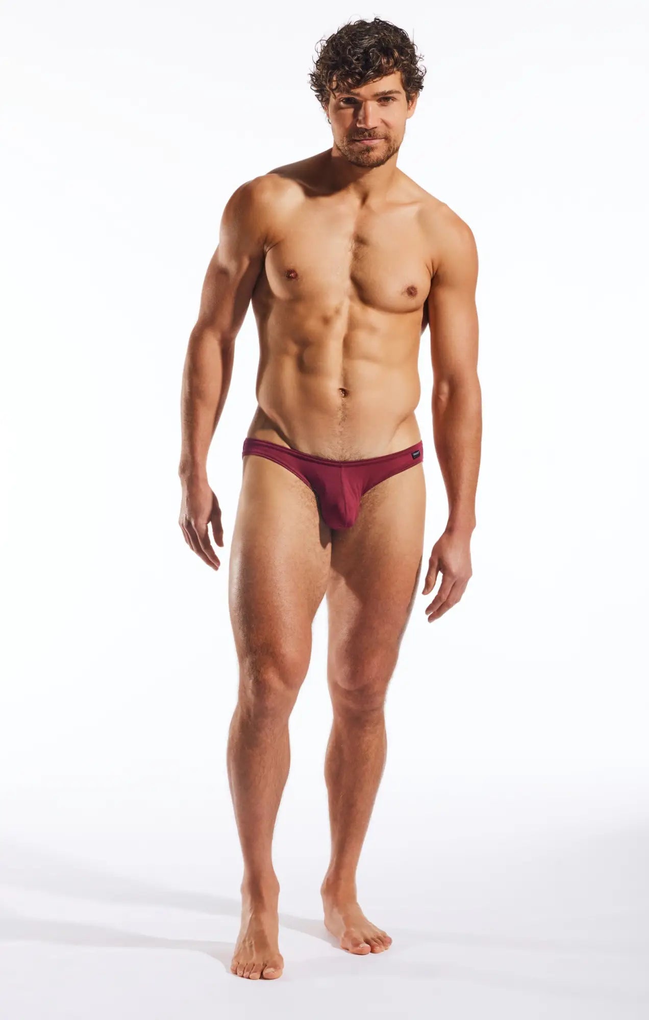 A maroon form-fitting brief with smooth fabric and minimalistic design in the CX01MD brief product line