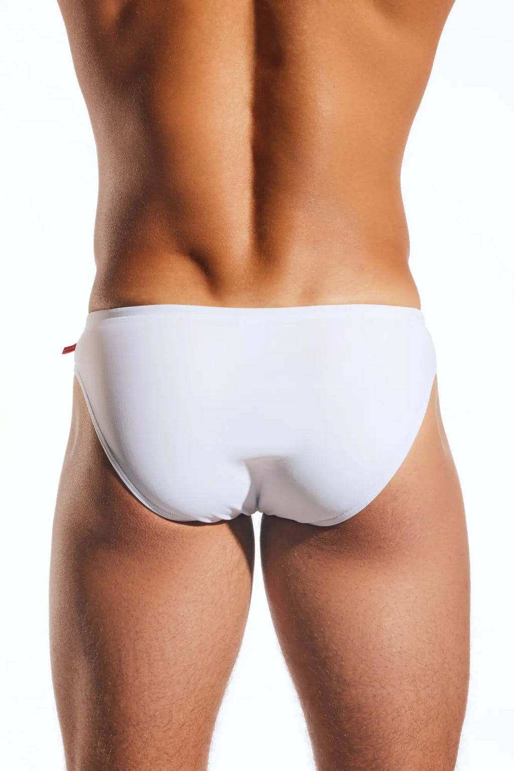 White CX04 drawstring swim brief with a subtle red tab on the side designed for comfortable beachwear