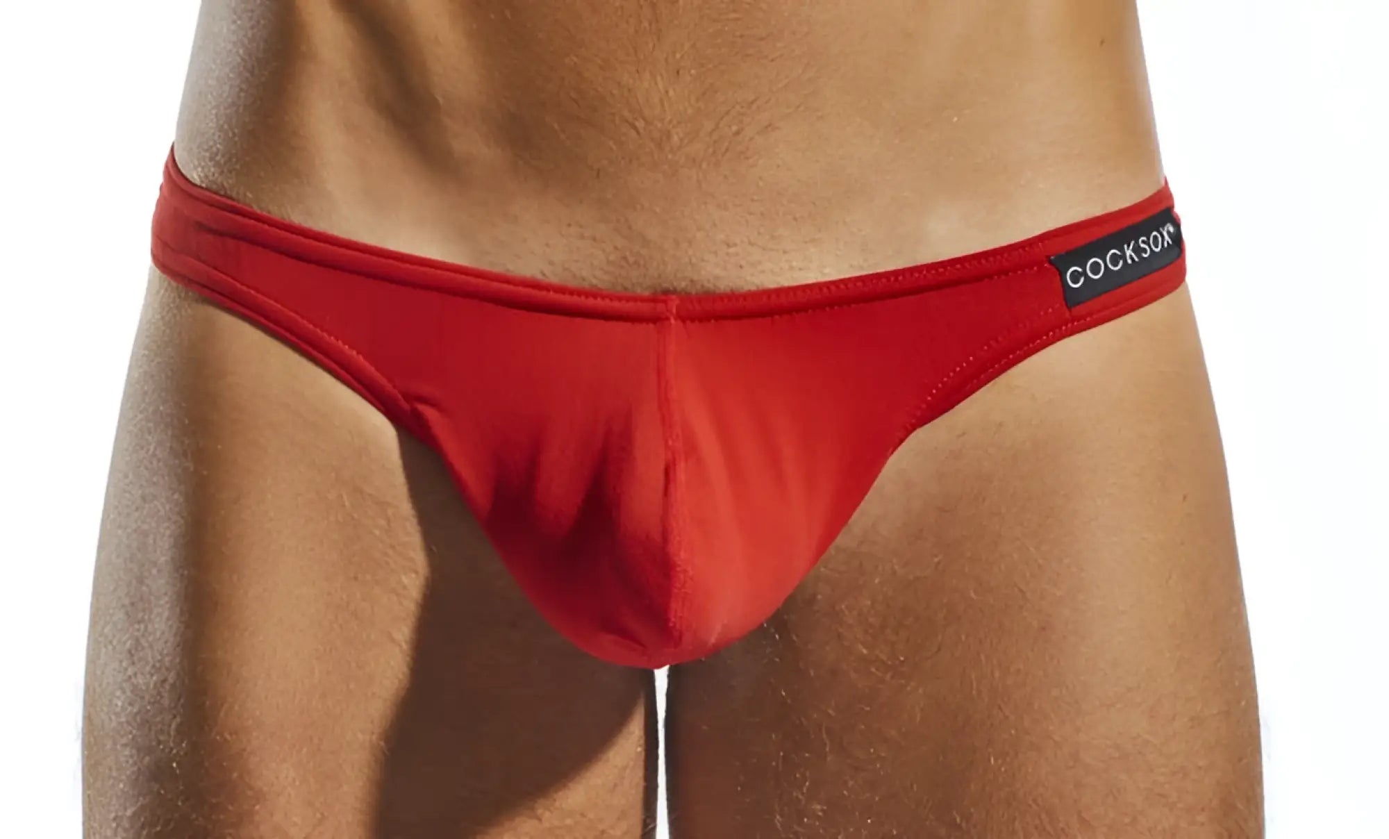 Red cockson cx05 thong briefs with smooth form-fitting fabric and black waistband label shown from the back side