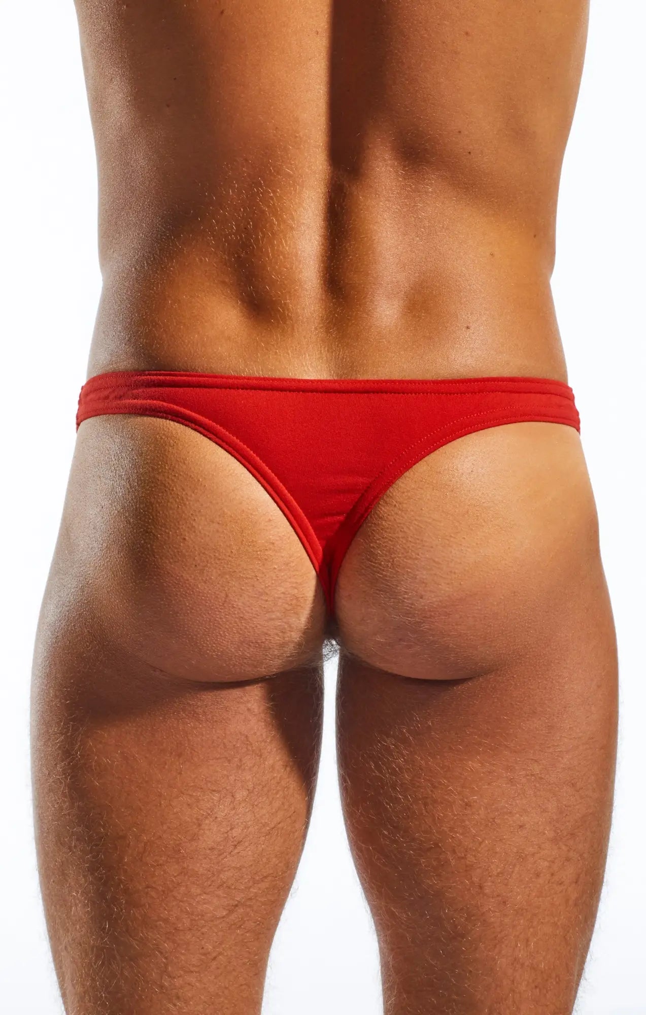 Red cx05 thong made of smooth fabric with a form-fitting design shown from the back side