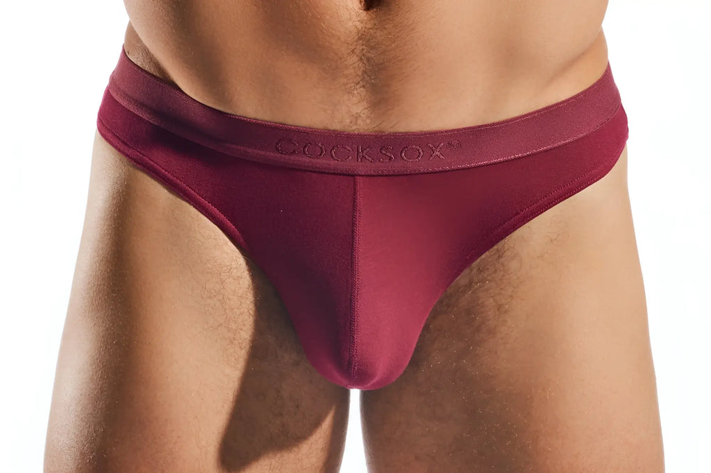 Maroon cocksox cx05md thong briefs with smooth stretchy fabric waistband shown from the back side