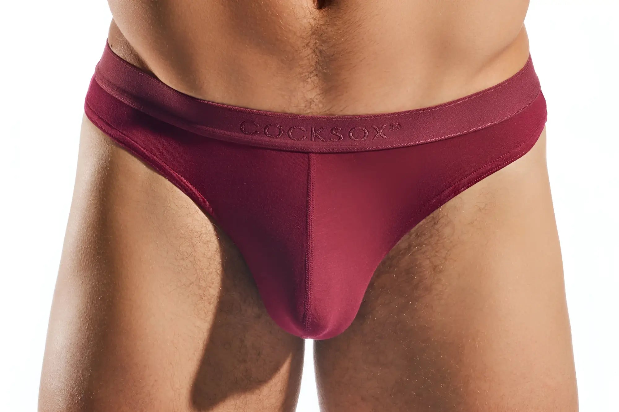 Maroon cocksox cx05md thong briefs with smooth stretchy fabric waistband shown from the back side