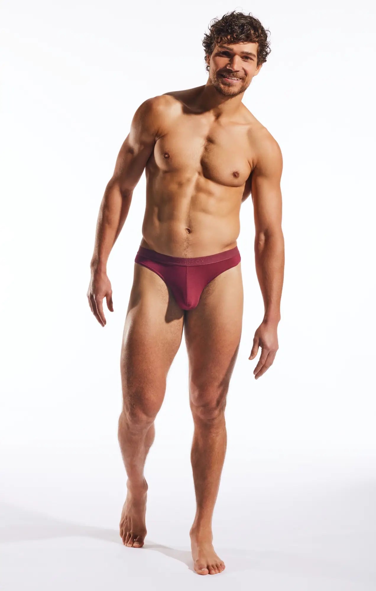 A maroon cx05md thong with smooth fabric and a minimalistic form-fitting design
