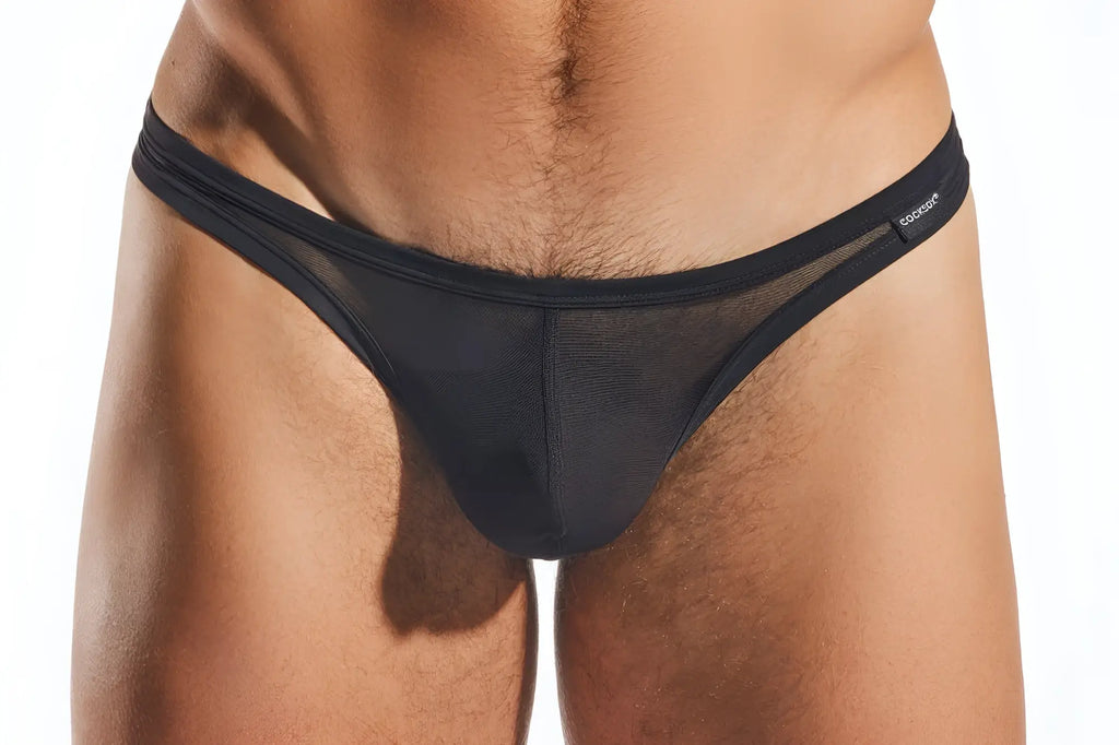 Black mesh thong cx05me with solid elastic waistband and cocksuit brand label on the side