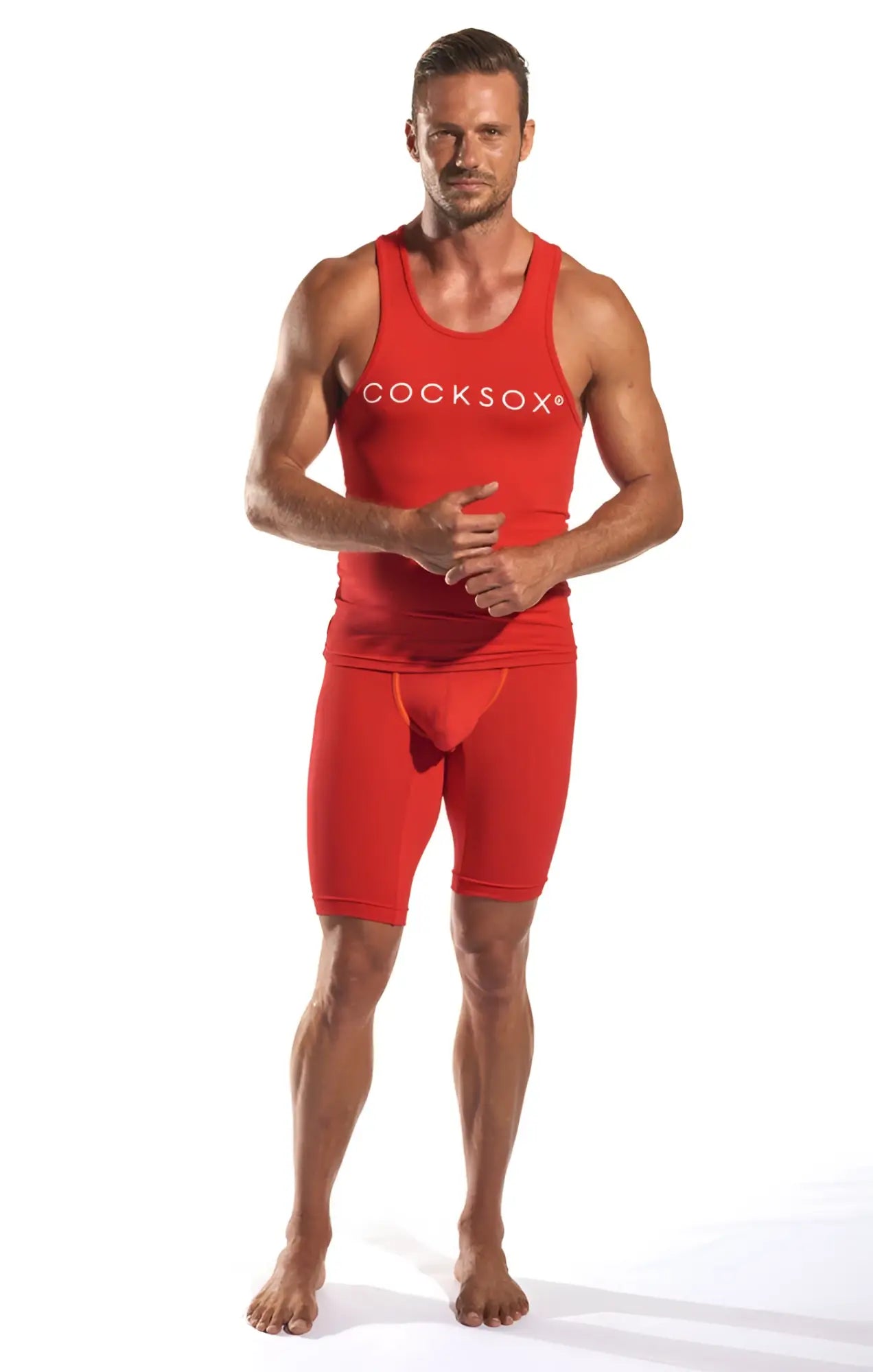 Red cocksox cx09 tank top and matching athletic shorts set in red performance fabric for active wear
