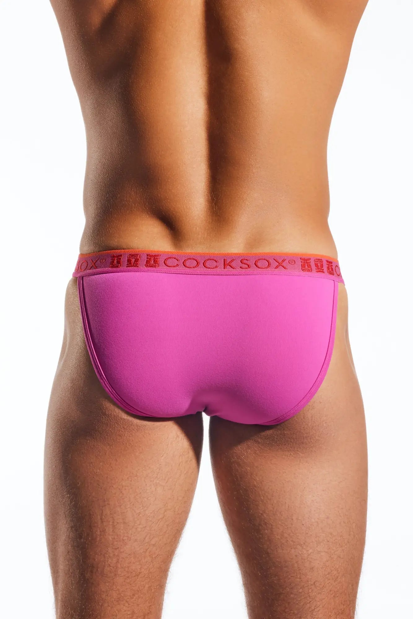 Bright pink cocksox cx16n bikini brief with a red logo waistband made for comfortable men’s underwear