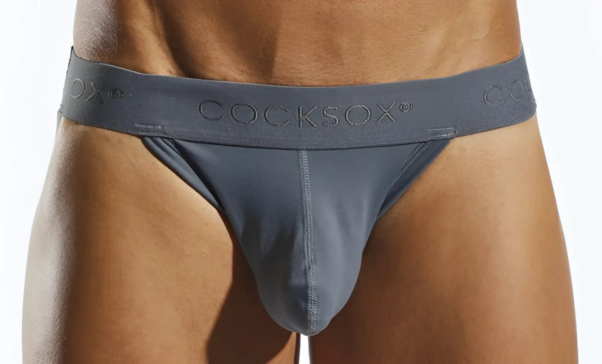 Gray cocksox cx21n jockstrap with smooth form-fitting design and subtle embossed branding on the waistband